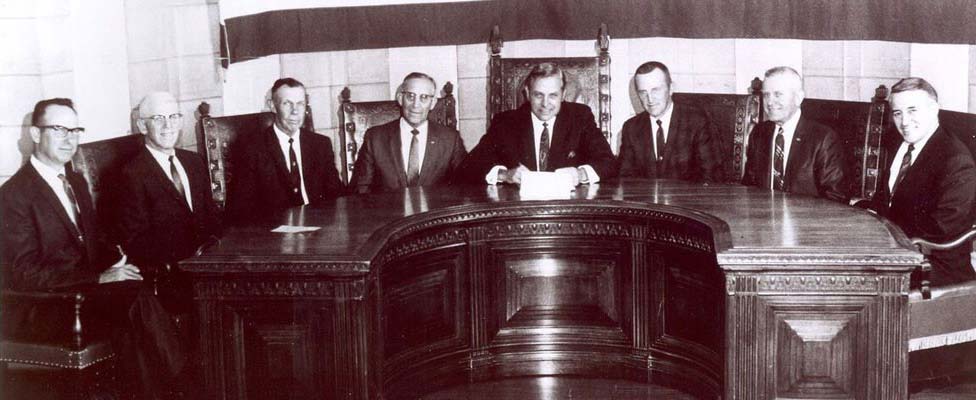 Group of Nebraska Legislature men sitting around a table.