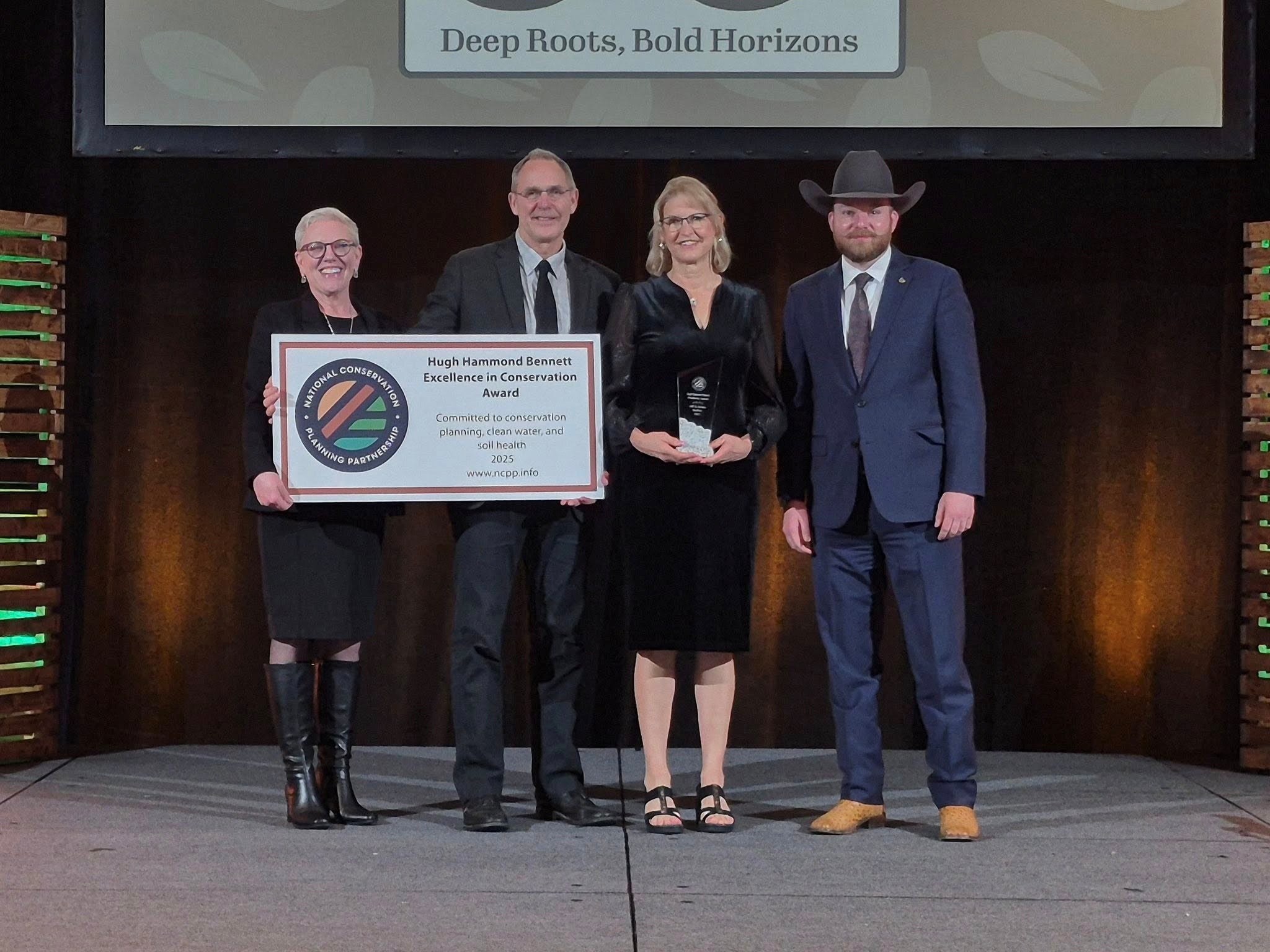 Jeff & Jolene Steffen accepting award with two other individuals