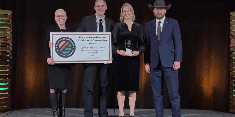 Jeff & Jolene Steffen accepting award with two other individuals
